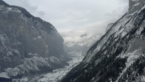 drone aerial of lauterbrunnen surrounded by the mountain eiger in the swiss alps