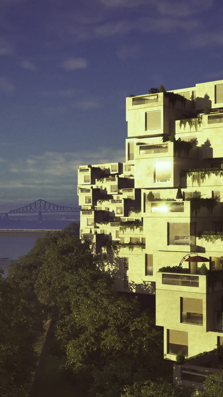 Modern architecture reflects sunlight over river at twilight