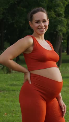 pregnant woman smiling outdoors