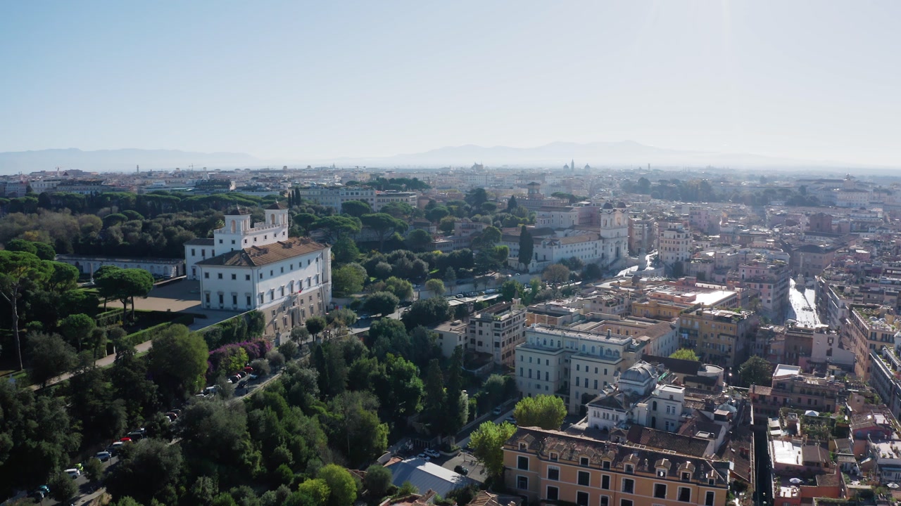 Aerial View of Villa Medici and Renaissance Gardens Surrounded by Lush Trees in Rome. Elegant Historic Residence Above the City Landscape. Spanish Steps and Famous Landmarks over Rome in Italy.