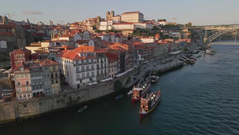 ribeira do porto aerial reveal, historic oldtown at sunset, portugal - aerial