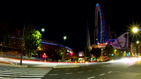 el lapso nocturno de 4k incluyendo la rueda de la fortuna de la cúpula de tokio