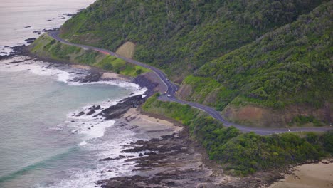 car driving along the great ocean road, aerial view