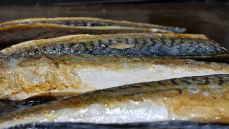 fish cooking on a griddle