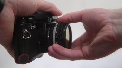 Cleaning-the-dust-out-from-the-inside-of-this-vintage-35mm-film-camera-with-a-rocket-blower