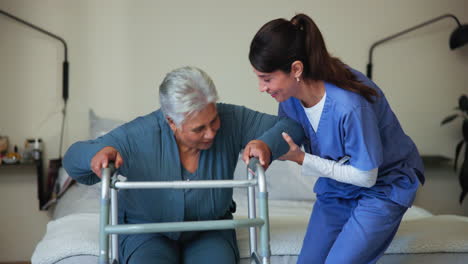 nurse assisting elderly woman with walker