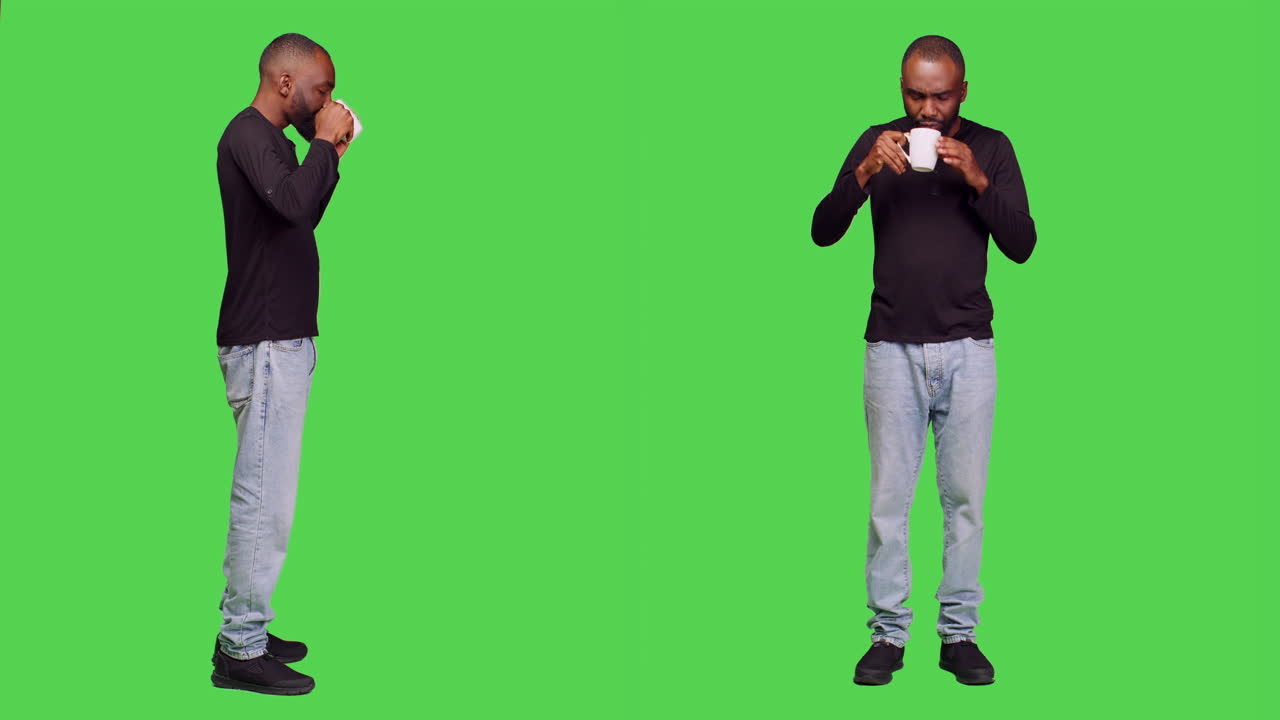 Man drinking from a cup on a green screen