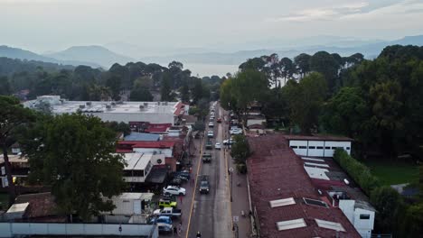 Aerial-drone-shot-of-a-village-with-a-lake