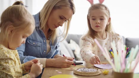 video of mother and daughter making easter decorations together