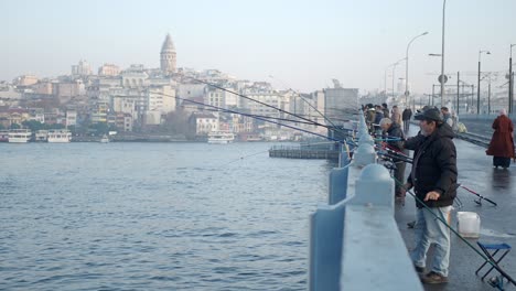 fishermen on a bridge in istanbul