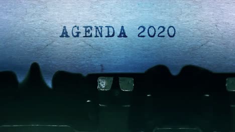 agenda 2020 word closeup being typing and centered on a sheet of paper on old vintage typewriter
