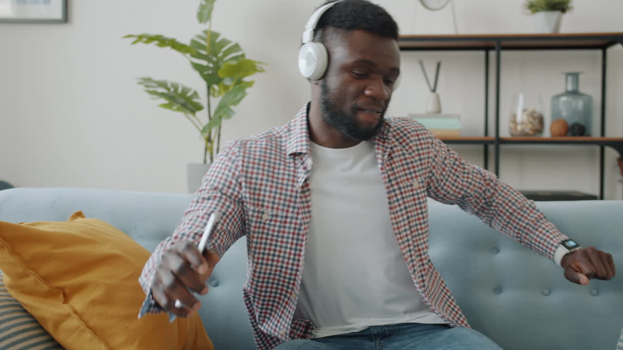 Man Enjoying Music on Couch