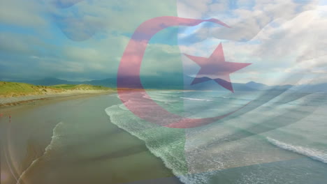 digital composition of waving algeria flag against aerial view of the beach