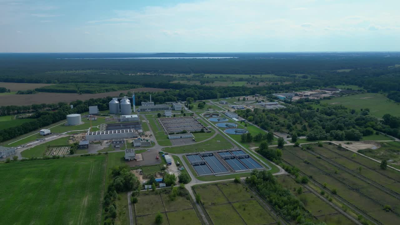 Wastewater treatment plant aerial view, demonstrating water purification process, ensuring environmental sustainability and resource management. Magic aerial view flight fly push forward drone