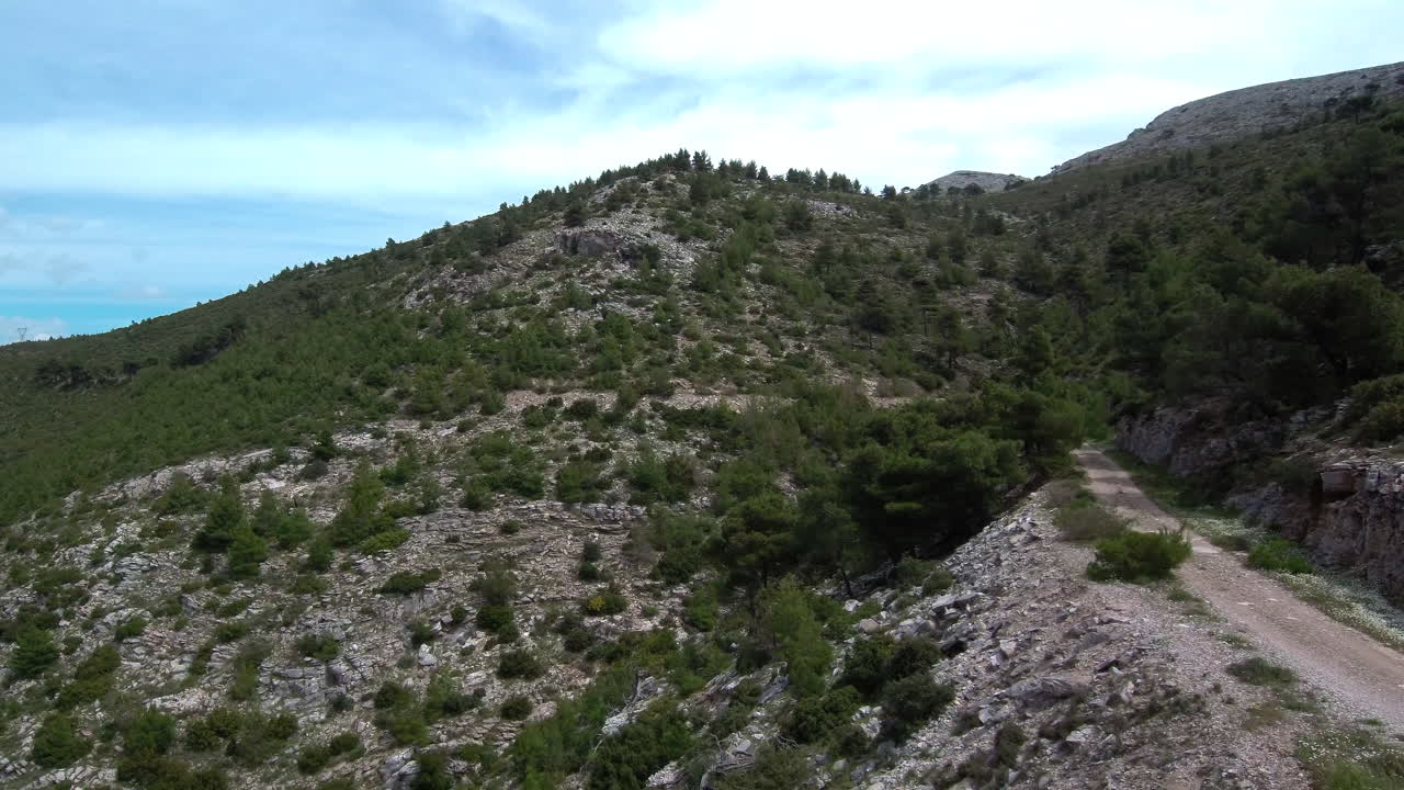 Penteli's gravel road winds through stunning natural scenery