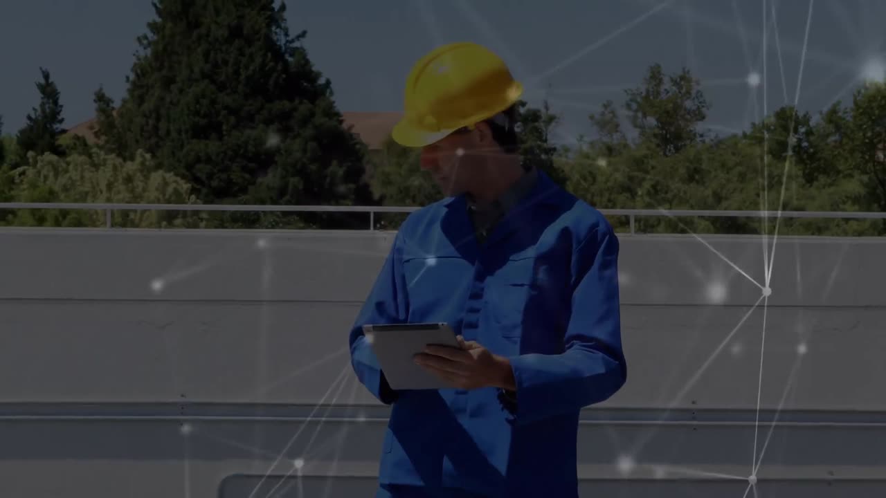 Animation of network of connections over caucasian engineer using tablet by solar panels