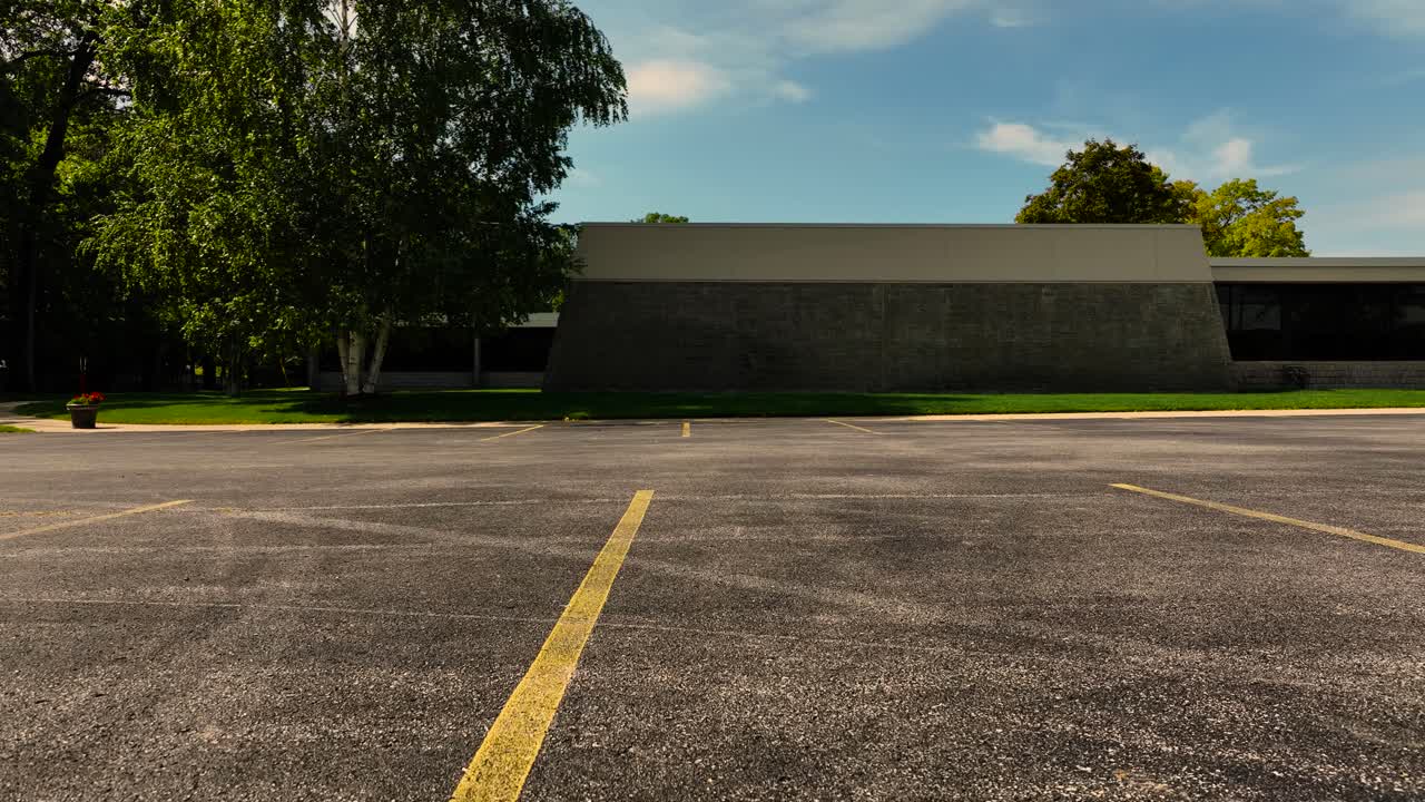 Drone lifting off from a parking lot near a local landmark