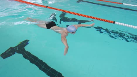 swimmer swimming into the pool