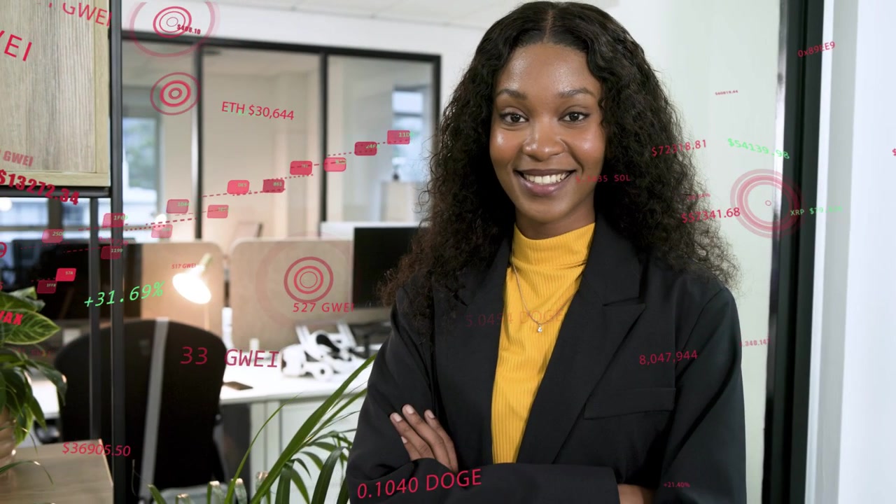 Woman by door red green data appearing around her crossing arms smiling showing business insight