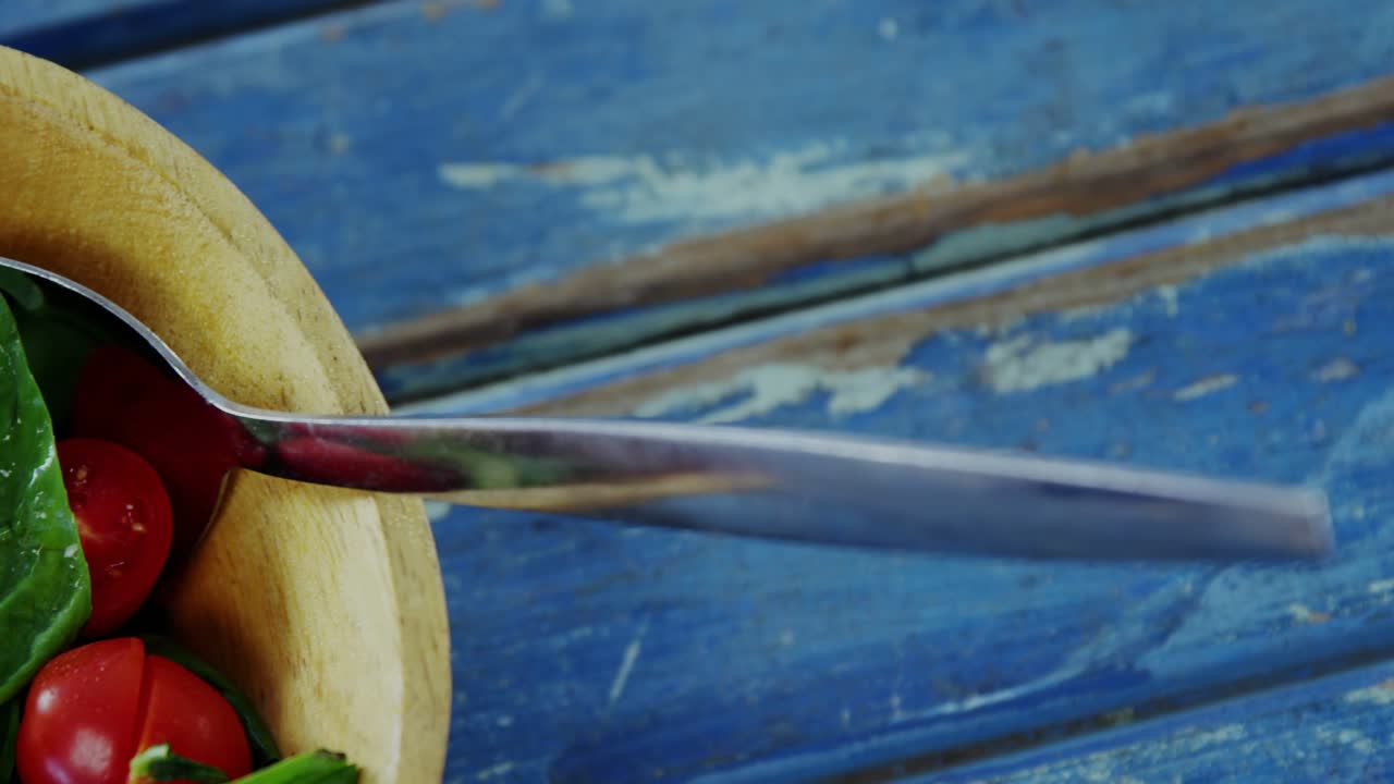 Blueprint overlays sliding in, tightening frame, wooden bowl emphasizing produce, spoon glinting