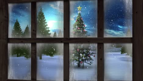 Wooden window frame against snow falling over christmas tree on winter landscape