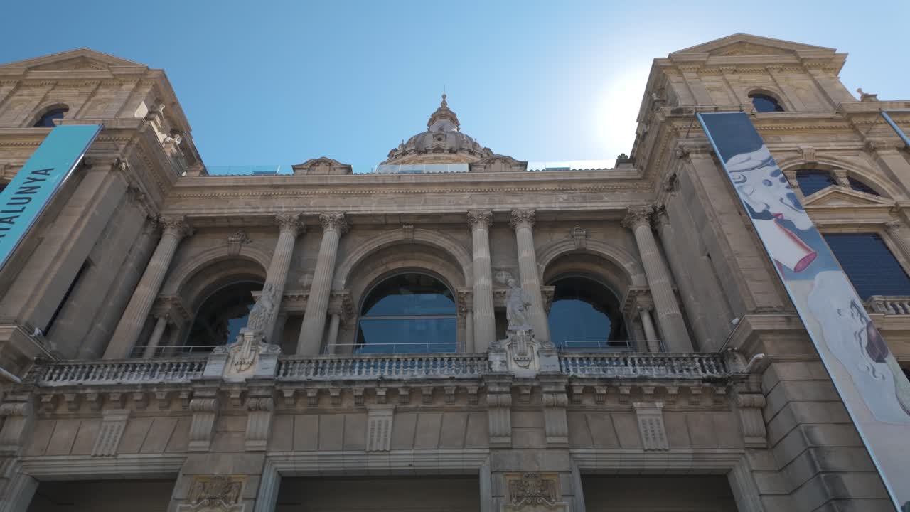 Establishing exterior pan of Museu Nacional d'Art de Catalunya with its grand facade and historic design