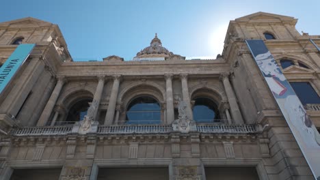 establishing exterior pan of museu nacional d'art de catalunya with its grand facade and historic design