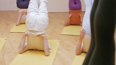 Group-of-people-performing-stretching-exercise-using-resistance-band