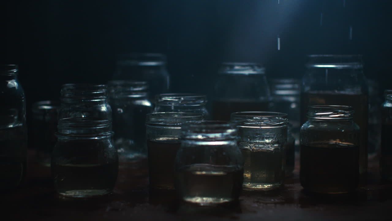 Water driping on glass jars