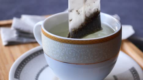 steeped tea bag in a porcelain cup