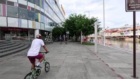 people riding bikes in a city plaza