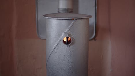 Fire-In-A-Small-Silver-Steel-Wood-Burning-Stove