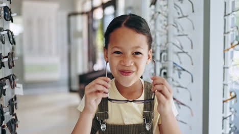 Kid,-happy-girl-and-shopping-for-glasses