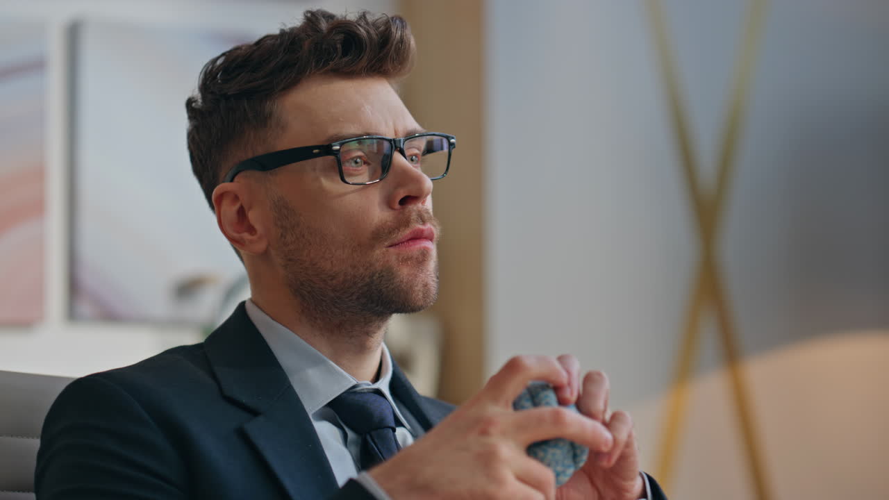 Closeup office manager thinking solution looking distance. Man tossing ball