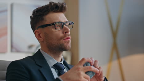 closeup office manager thinking solution looking distance. man tossing ball