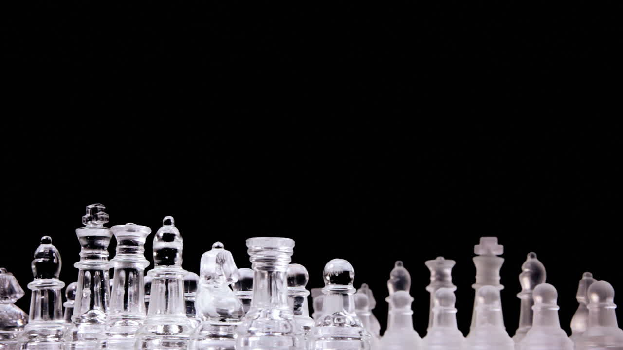 A splendid chessboard with two different full sets of chess pieces , rotating into a starting position: the choice of the side to take has been made