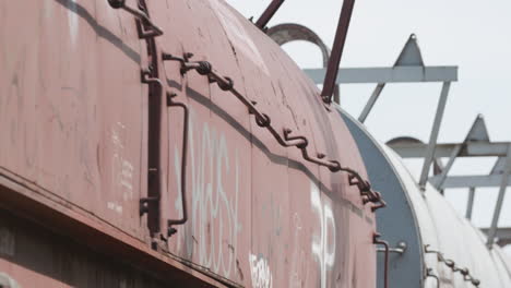 low angle closeup of freight train cars passing by