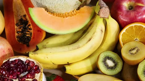 assorted fruits arranged on a white background