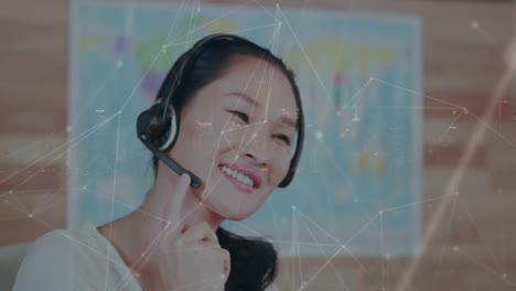 Animation-of-connected-dots-on-asian-customer-service-representative-talking-to-customer-over-city