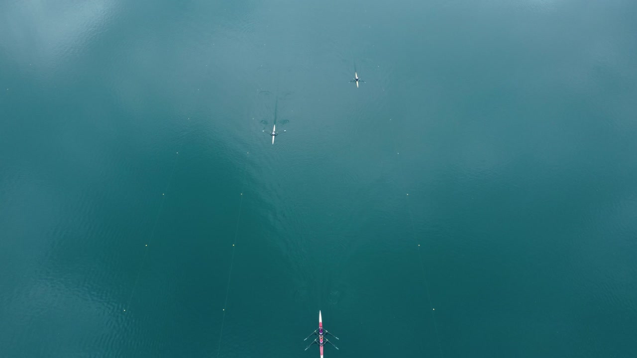 AERIAL Top-Down Shot of Kayakers Racing in a Lake