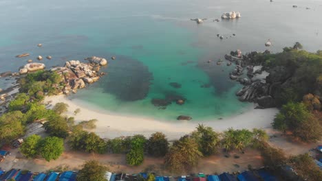 top down view of tanjung tinggi beach during sunrise at belitung, aerial