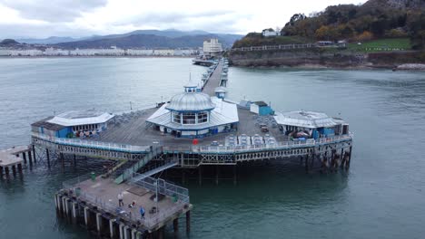 llandudno pier historic victorian wooden boardwalk seaside landmark aerial view slow fly past pavilion