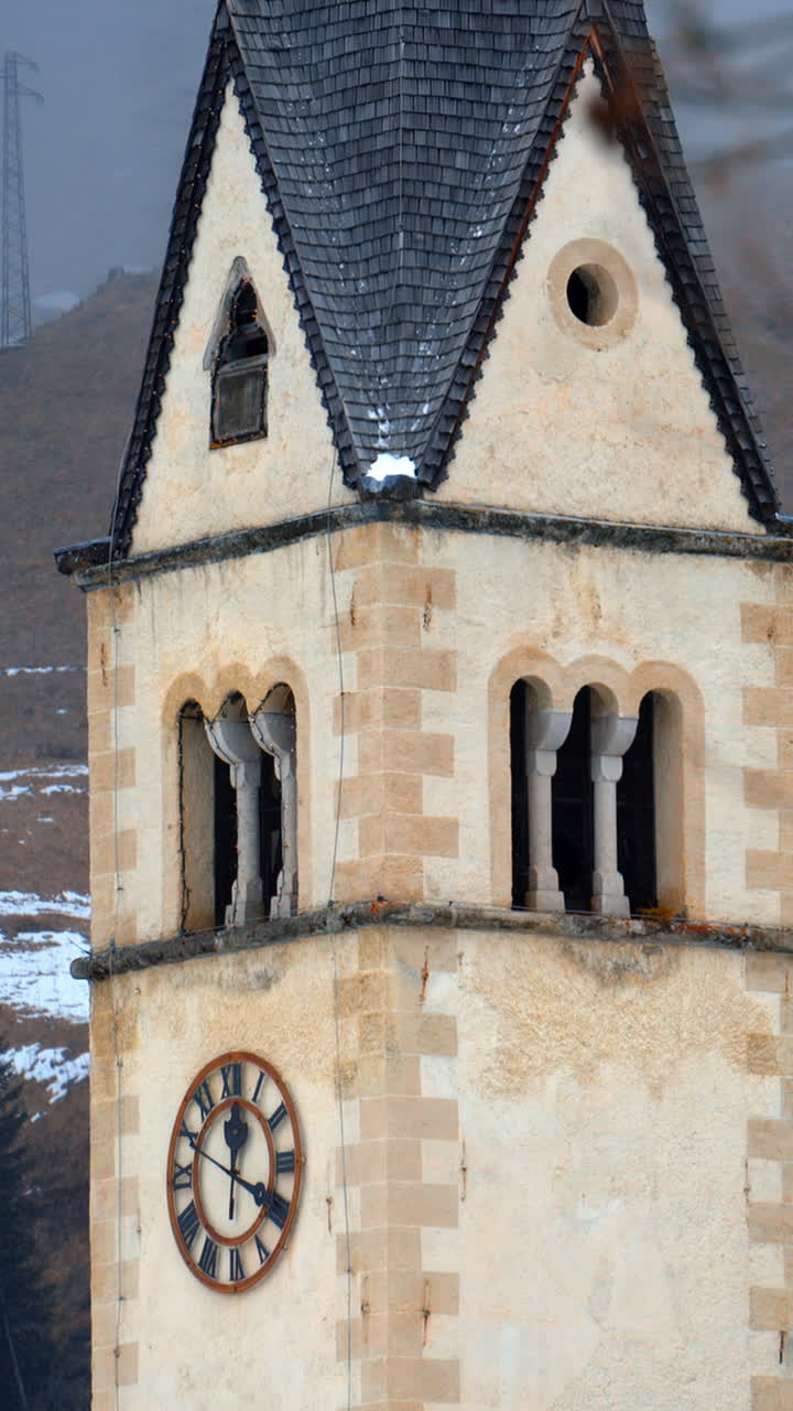 Distant view of the Chiesa di Arabba in the Arabba village, in the Dolomites, Italy. Vertical