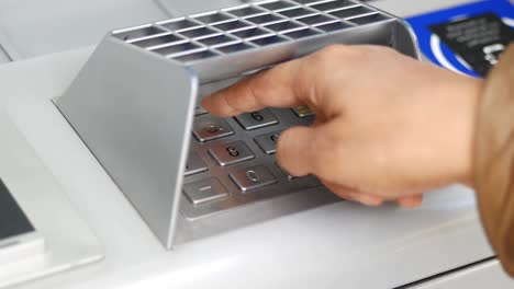 close up women hand pressing on atm machine