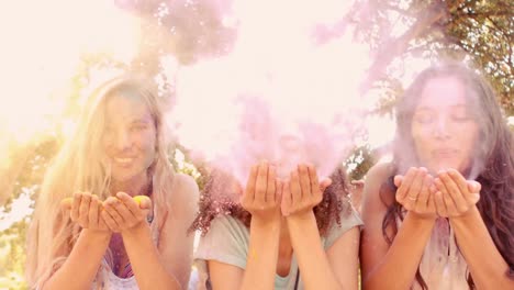 young women having fun with powder paint