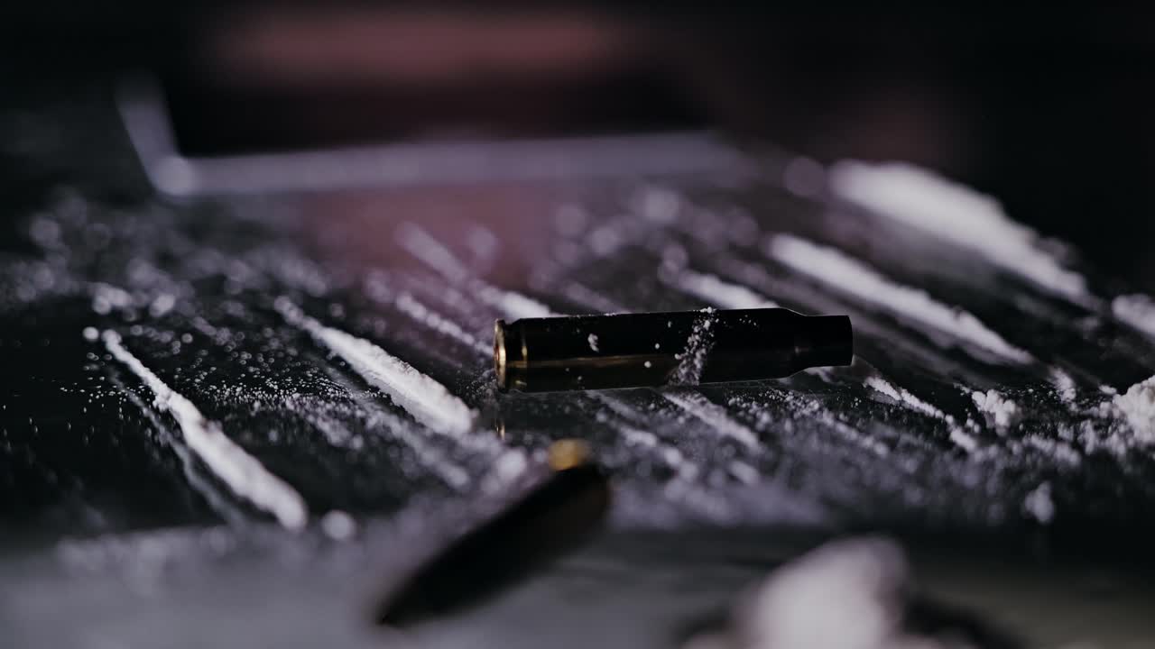 Symbolic image linking violence crime, addiction through falling bullet shells