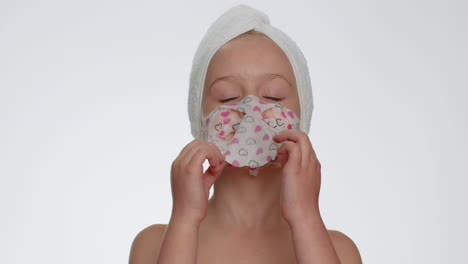 Child-girl-removing-cosmetic-moisturizing-face-mask,-teenager-facial-skin-care,-natural-cosmetics