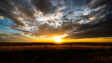 blazing sunset colors fill the sky with drifting clouds time lapse