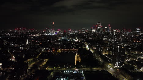 aerial: shadwell, st katharine's and wapping, downtown london backdrop, night