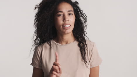 african american confident woman over white background.